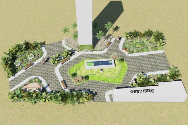 Top view of a landscaped outdoor area with pathways, benches, and greenery.