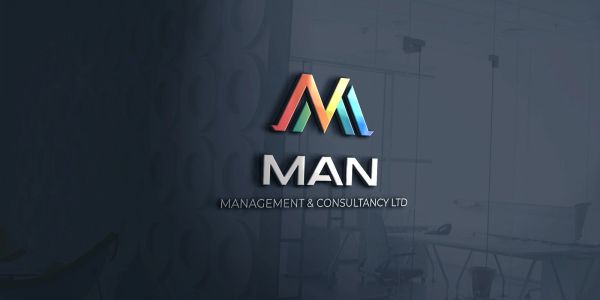 Colorful logo of MAN Management & Consultancy Ltd on a glass office wall.