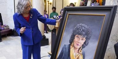 Photo of Mississippi's 1st Black female state legislator & her hand-painted portrait in the capital