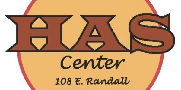 Logo of HAS Center in Hesston, Kansas, featuring bold brown letters and address.