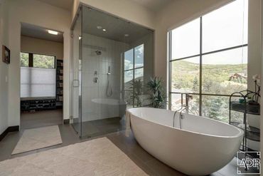 master bath with shower and freestanding tub
