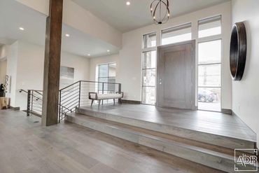 interior modern white front entrance with wooden beam