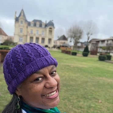 Greer on the grounds of the Château Grand Barrail with the chateau in the background.