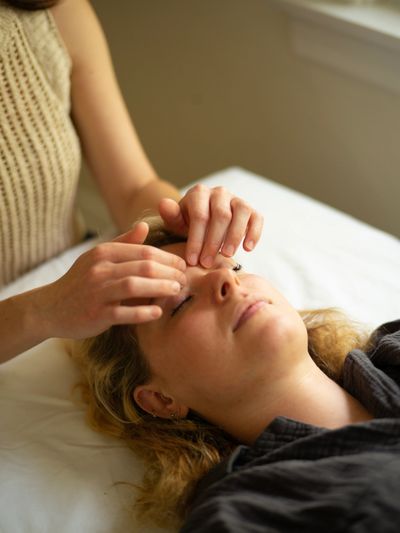 Patient receiving brain therapy during a treatment session