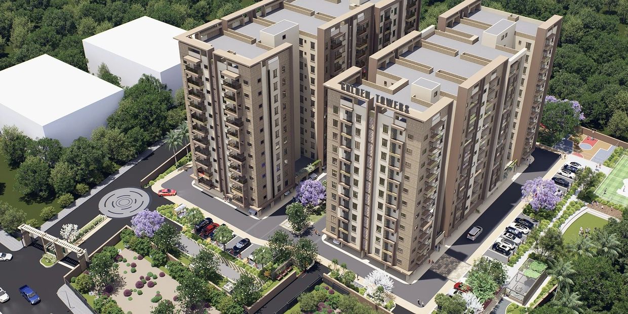 Modern Golden Towers residential buildings surrounded by greenery and parking.