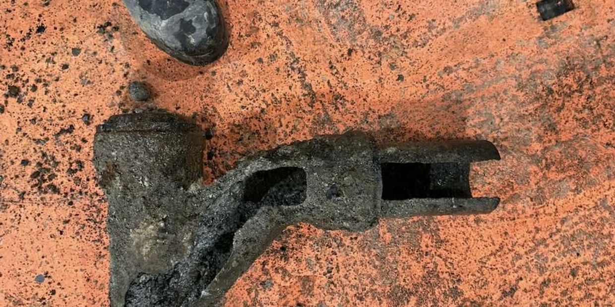 Severely corroded and collapsed sewer pipe removed during sewer line repair in King County WA