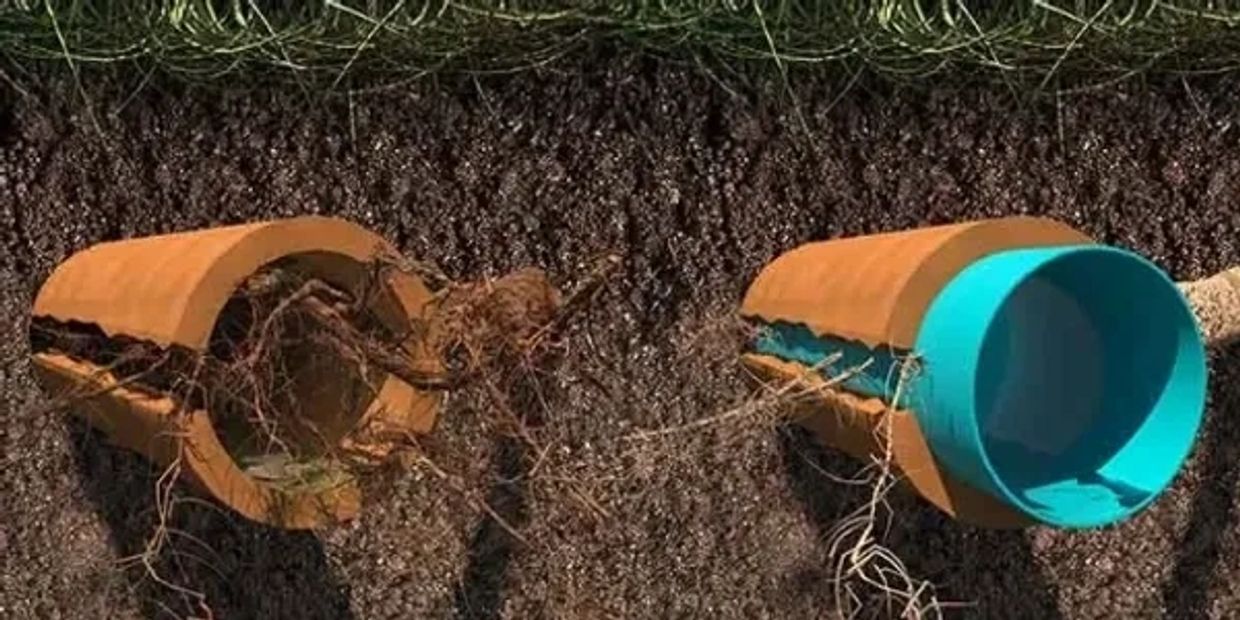 Cross-section showing trenchless CIPP liner installed inside cracked clay sewer pipe during no-dig r