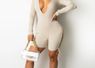 All Night Romper 
90% Rayon
10% Spandex
Has stretch 
Adjustable strings 