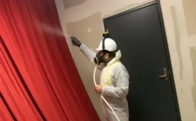 Fabric Fire Retardant being applied to movie theater drapes