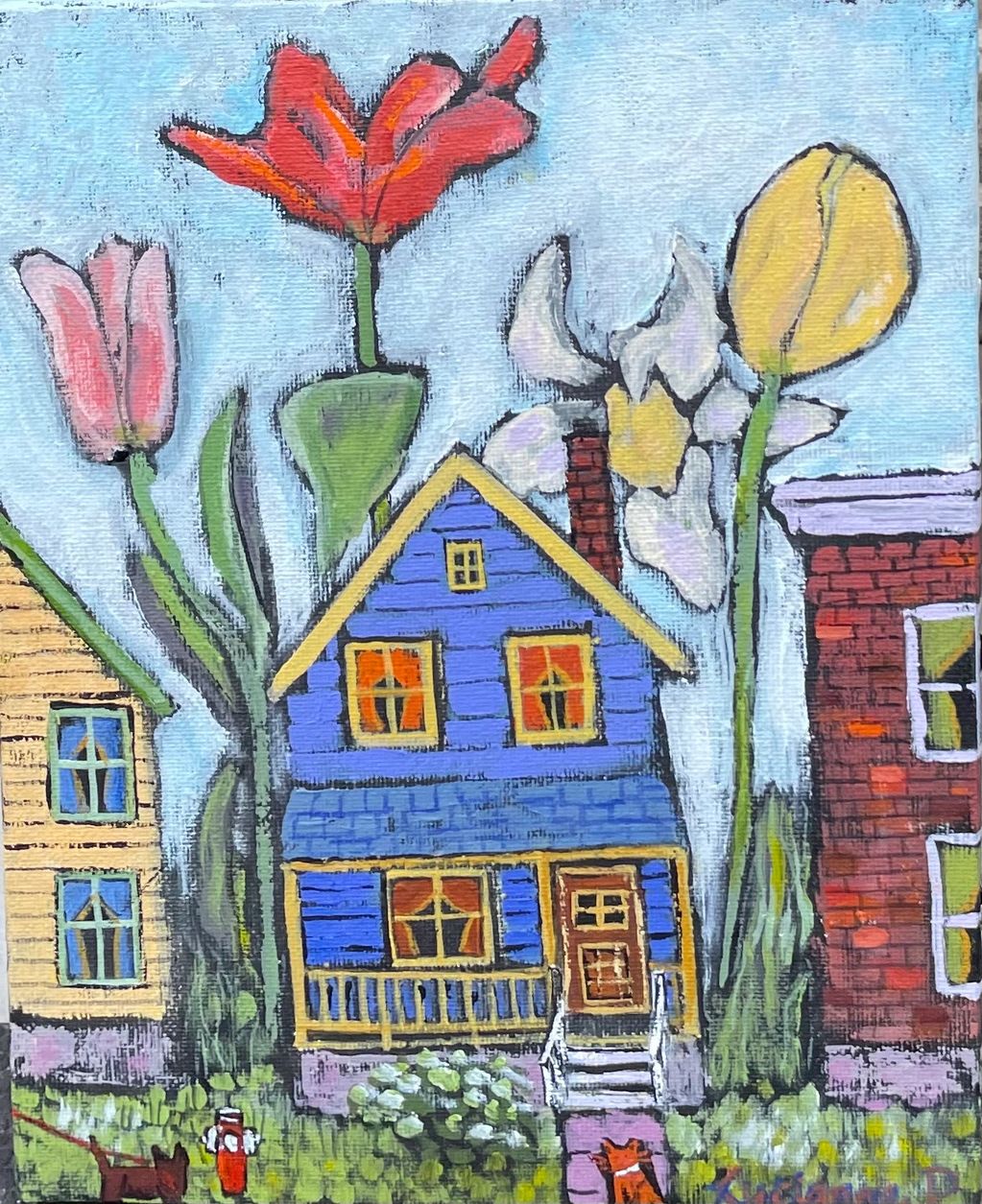 Giant tulips grow behind colourful houses.