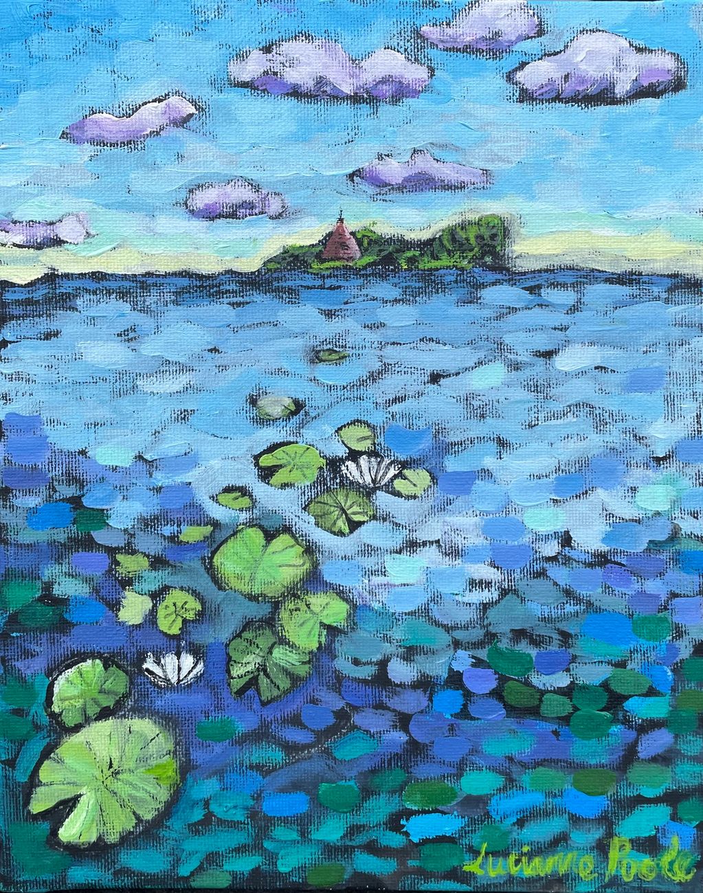 Waterlilies float in the St Lawrence River, as the Cairn rises from an island in the distance.