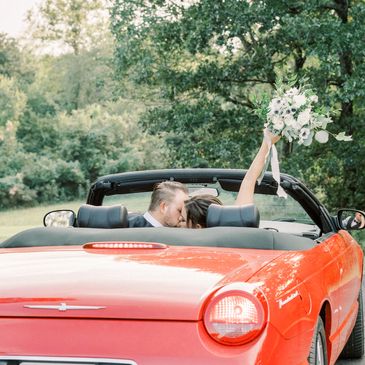 Couple in the getaway car leaving The Bella Donna Wedding Chapel & Event Center.