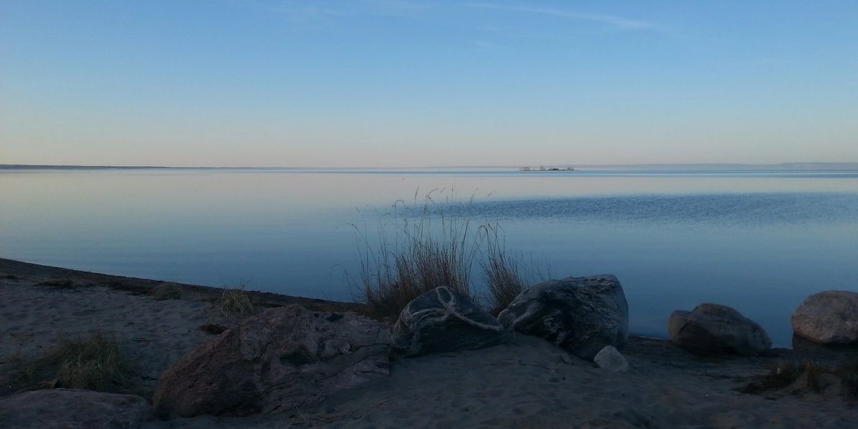 Calm Georgian Bay water representing stillness, mindfulness, and emotional healing.