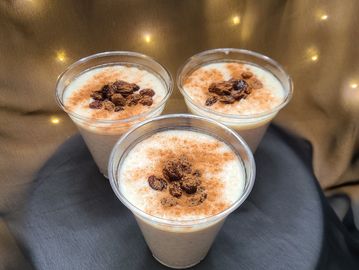 Abuelitas’s nostalgic rice pudding with cinnamon flavor topped with raisins. Gluten Free desserts.