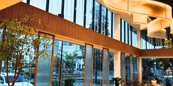 Modern interior with large windows and stylish lighting.