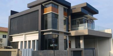 Modern two-story house with glass and wood accents.