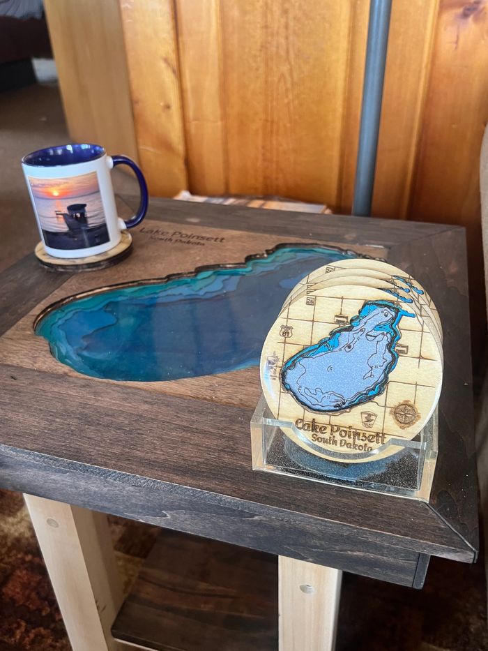 Lake Poinsett themed wooden table with matching coasters and a mug.