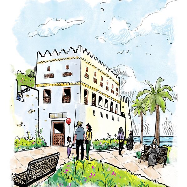 People enjoying a sunny day near a historic building by the sea.