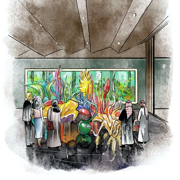 People admire colorful glass art in a modern gallery.