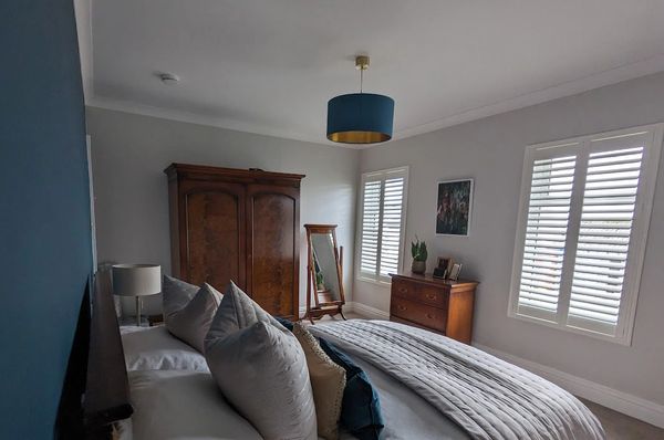 Luxury bedroom with wooden shutters