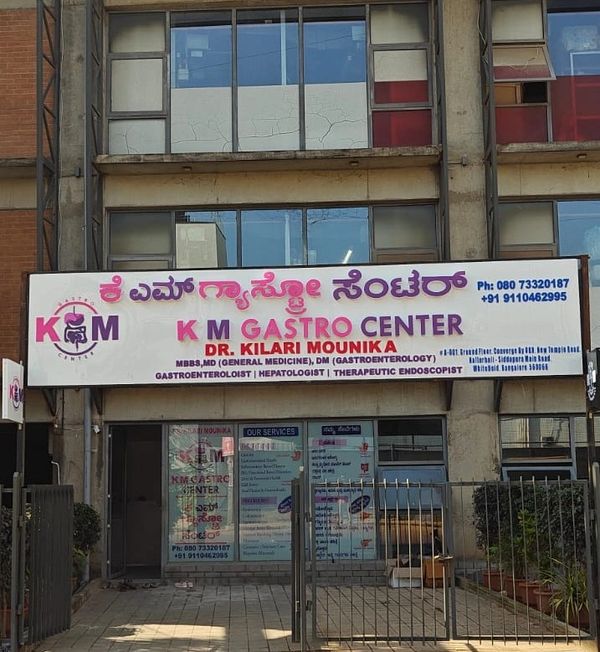 KM Gastro Center signboard showcasing Dr. Kilarri Mounika's gastroenterology services.