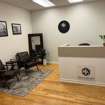 Modern office reception area with chairs and branded decor.