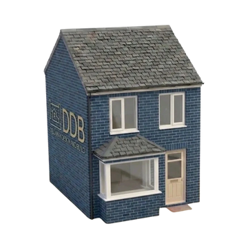 A small two-story blue brick house with white windows and a grey roof.