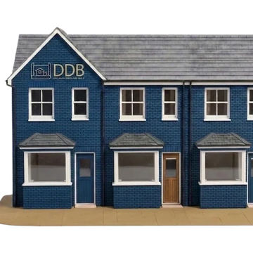 Blue brick building with three entrances and white window frames.