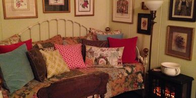 Victorian daybed and electric fireplace in Tamarack Cottage.