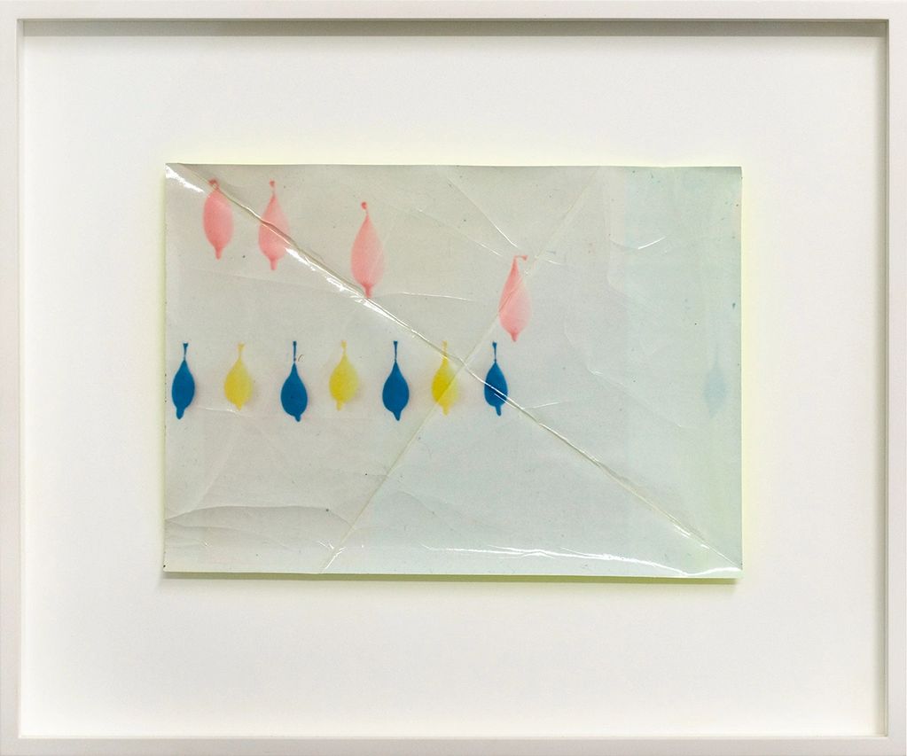 Abstract art with pink, blue, and yellow shapes on a cracked surface.