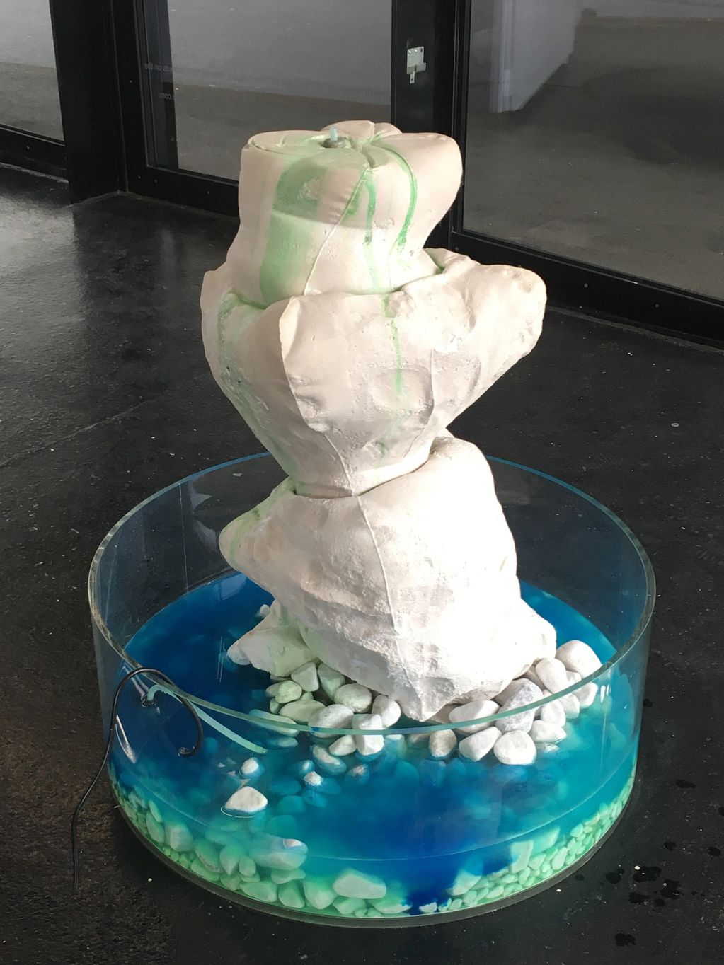 Plaster fountain with coloured water 