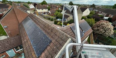 Cherry picker over solar panels