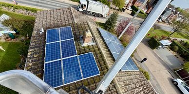 Cherry picker over solar panel pigeon proofing.