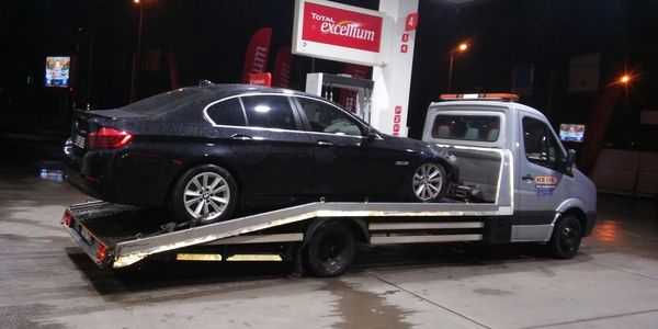 A tow truck transporting a car