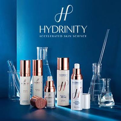 Hydrinity skincare products with scientific lab glassware background.