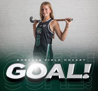 Female field hockey player celebrating a goal for Bobcats.