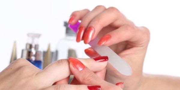 A person looking at the nails and with a scale.