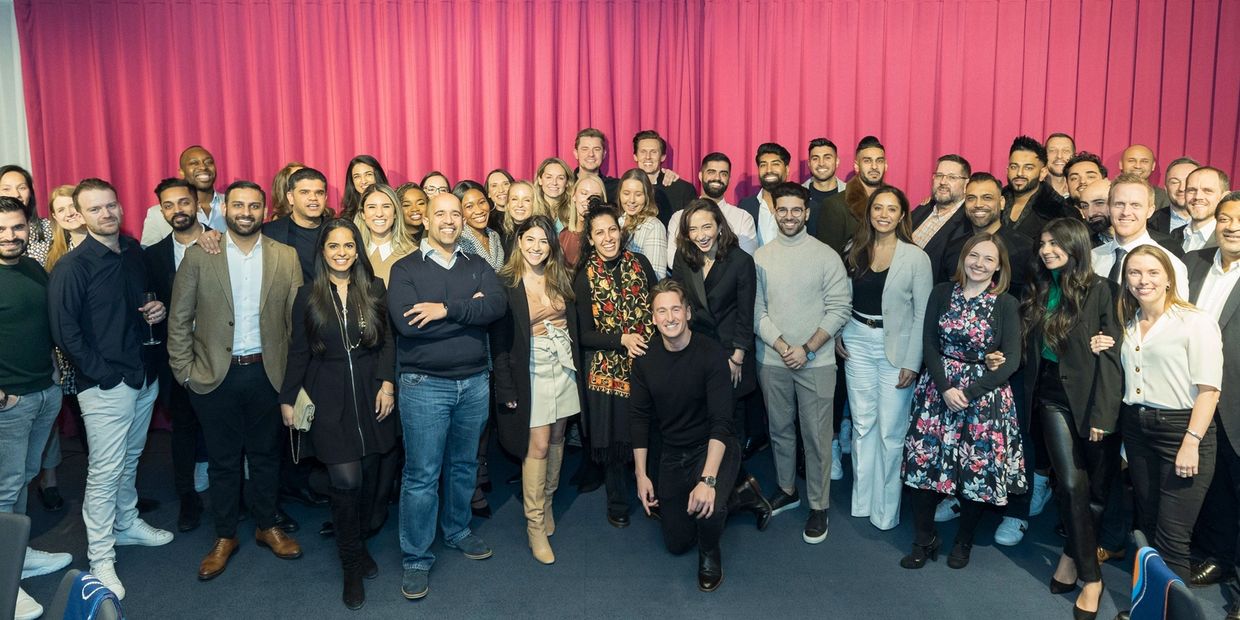 Group of people smilling for photo.