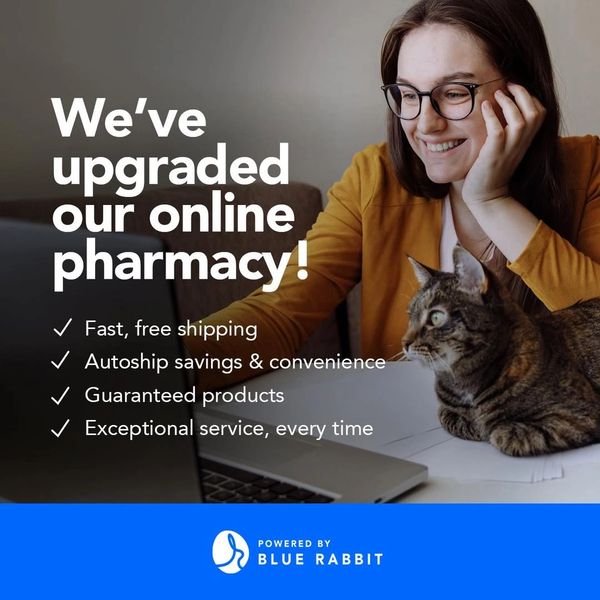 Smiling woman with cat promoting upgraded online pharmacy benefits.