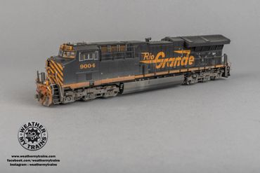 Detailed model of a Rio Grande locomotive train on display.