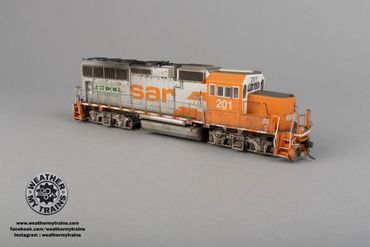 Detailed model train locomotive with orange and gray paint, labeled SAR 201.
