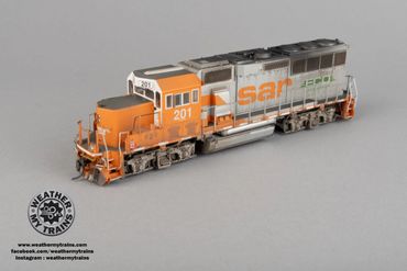 Detailed model train locomotive with orange and gray colors labeled SAR 201.