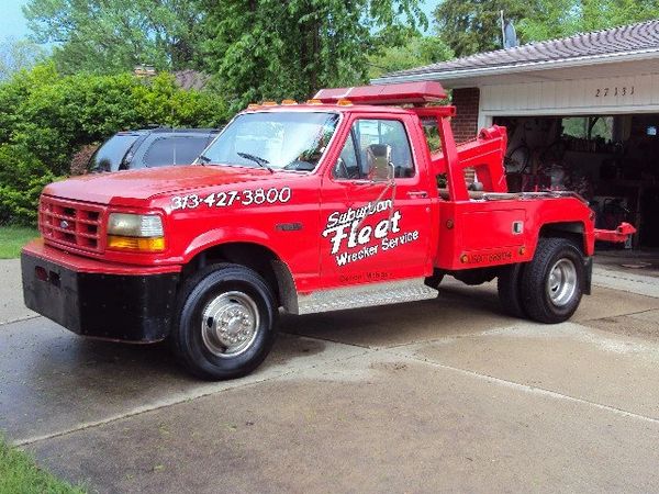 Wrecker Tow Truck Wheel Lift parking structures wincing places that not every truck can get into bac