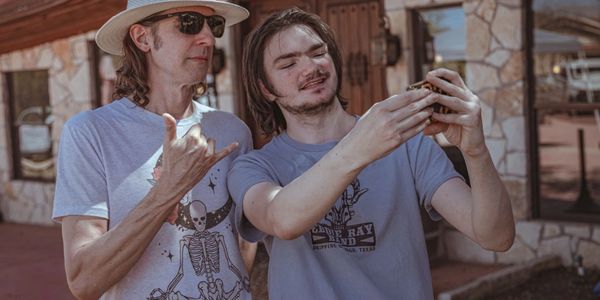 A person taking a photo with other person
