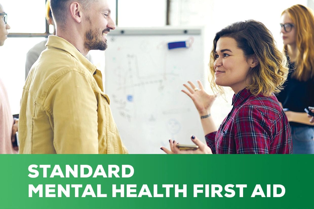 Two people discussing mental health first aid.