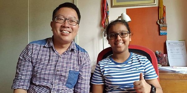 Mr Lawrence Ong with a Primary Math student during a one-to-one tuition lesson