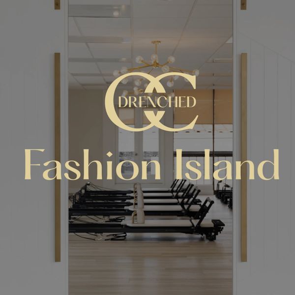 Elegant fitness studio entrance with Drenched Fashion Island logo.