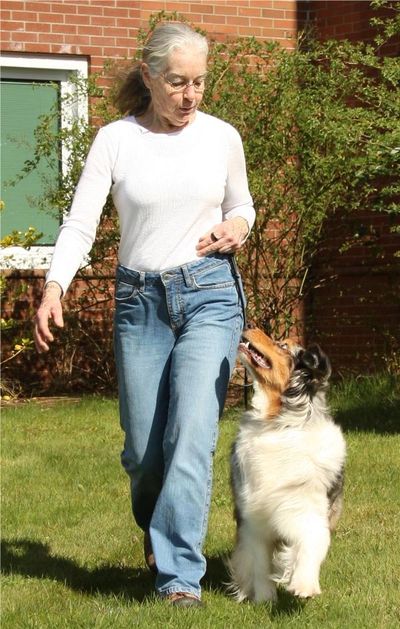 A woman training a dog