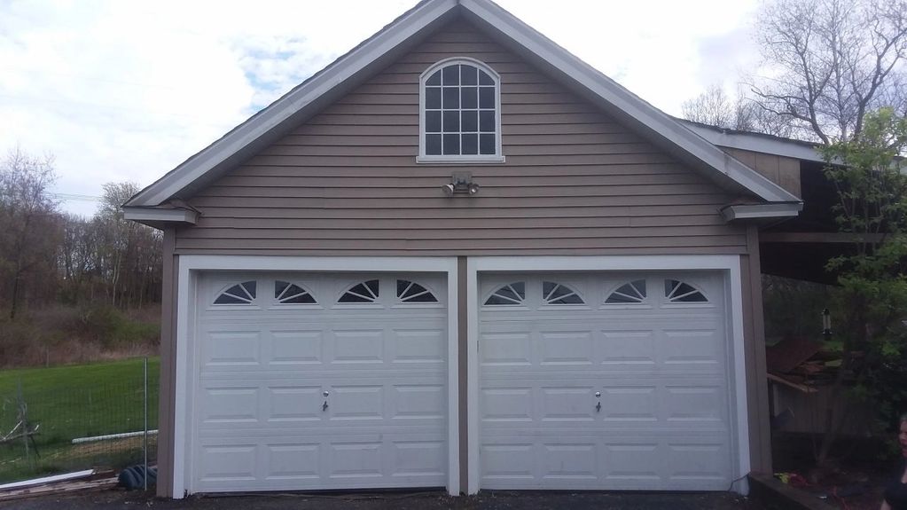 Updated garage vinyl siding and new trim