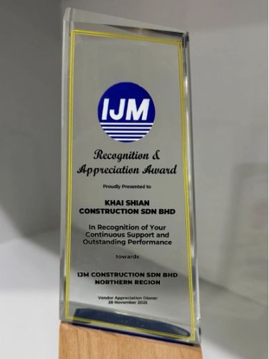IJM Recognition & Appreciation Award trophy with wooden base.